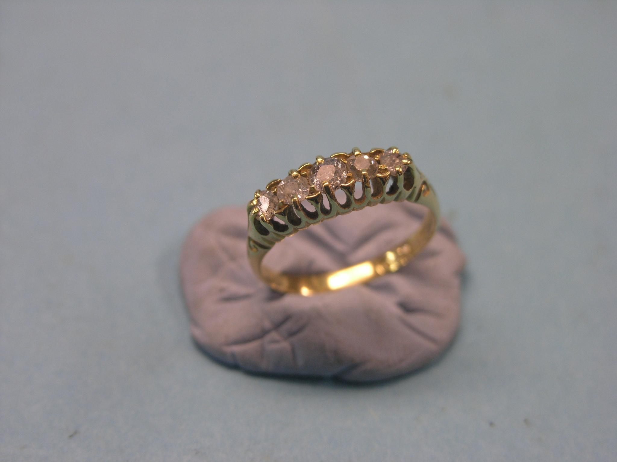 Appraisal: An ct gold and diamond half-hoop ring five graduated diamonds