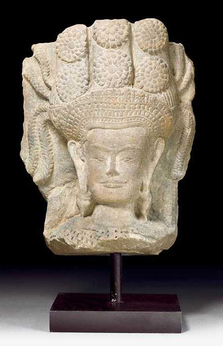 Appraisal: LARGE APSARA HEAD Khmer in the style of Angkor Vat