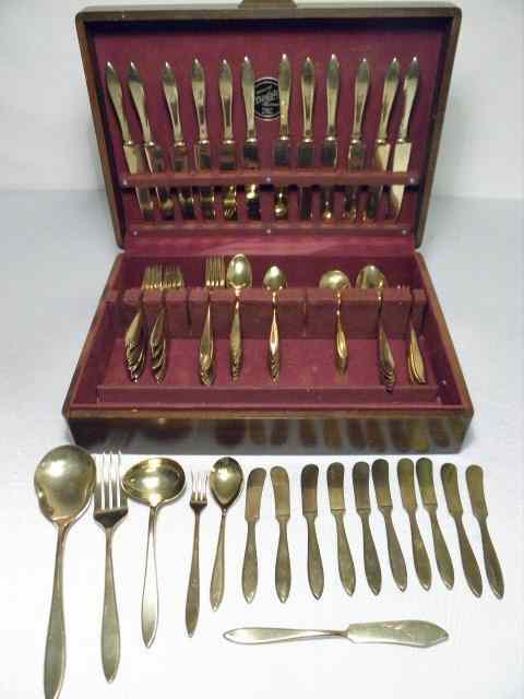 Appraisal: Dirilyte gold toned flatware group Includes '' forks '' forks