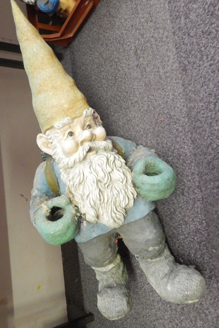 Appraisal: A large German composition garden gnome with a pointed hat