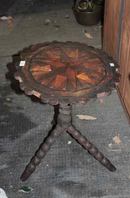 Appraisal: A RUSTIC PARQUETRY TOPPED OCCASIONAL TABLE standing on turned support