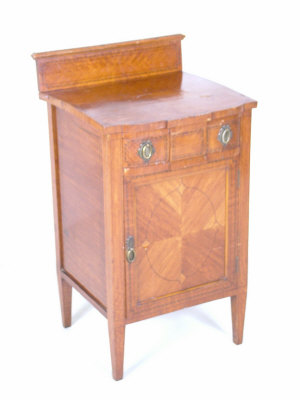 Appraisal: A late Victorian satinwood pot cupboard the raised shaped top