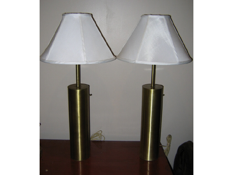 Appraisal: NESSEN BRONX NEW YORK Pair of brass cylindrical table lamps