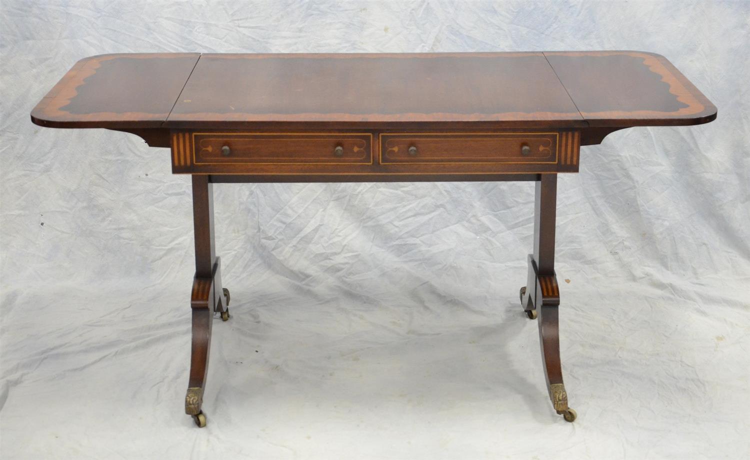 Appraisal: Banded mahogany Regency style sofa table with drop leaf ends