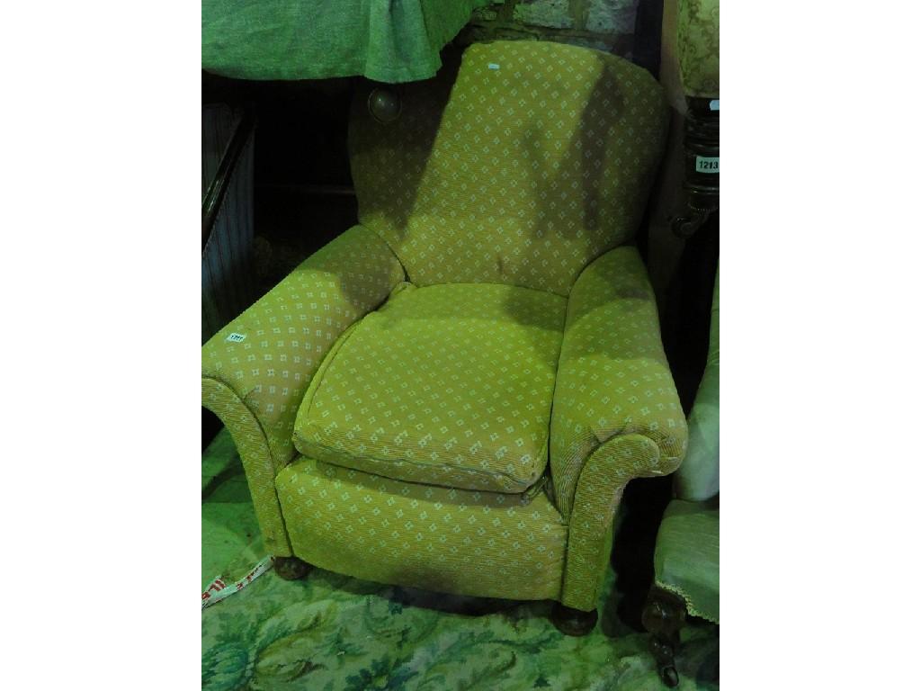 Appraisal: An Edwardian easy chair with yellow ground floral upholstery shaped