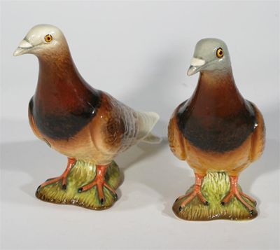 Appraisal: Pigeon' model N two Beswick bird figures painted in colours