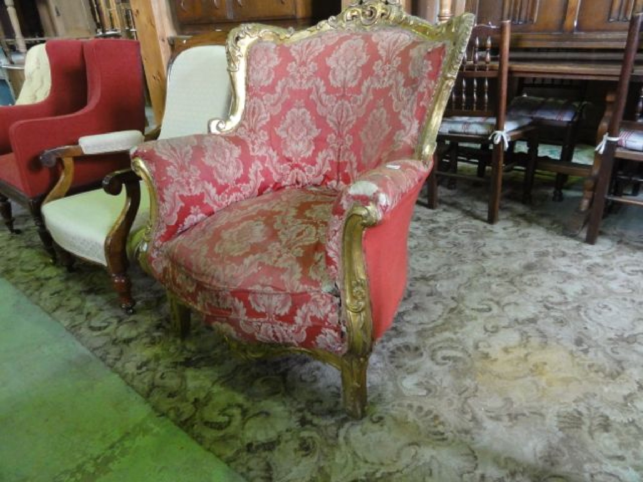 Appraisal: A substantial gilt framed armchair with scrolling acanthus and further