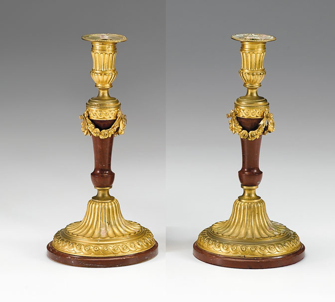 Appraisal: Pair of Louis XVI style gilt-bronze mounted rouge marble candlesticks