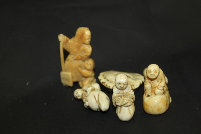 Appraisal: A COLLECTION OF SIX JAPANESE CARVED IVORY NETSUKE including a