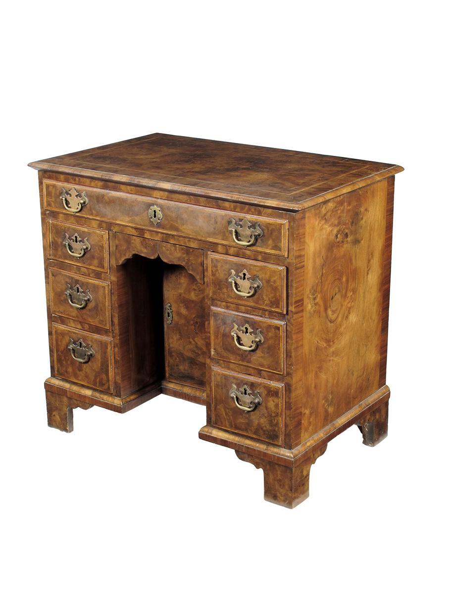 Appraisal: A burr walnut kneehole desk