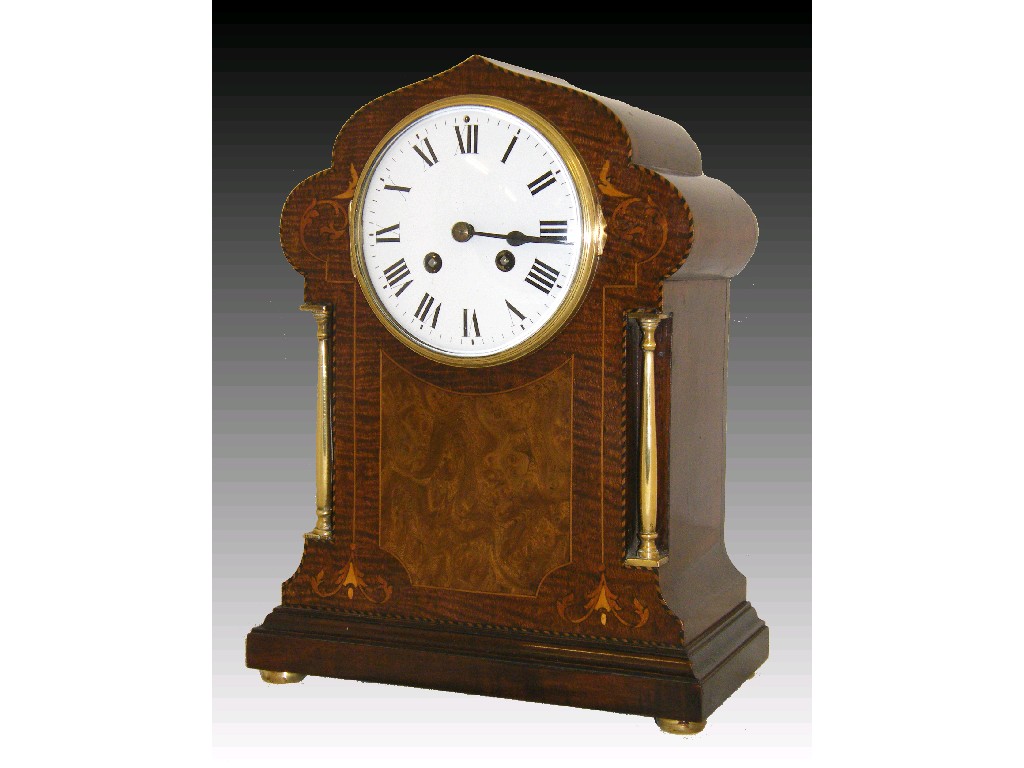 Appraisal: French figured mahogany two train mantel clock the Japy Freres