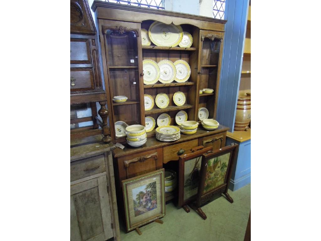 Appraisal: A Victorian oak dresser the lower section fitted with a