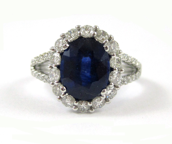 Appraisal: SAPPHIRE DIAMOND AND FOURTEEN KARAT WHITE GOLD RING with round-cut