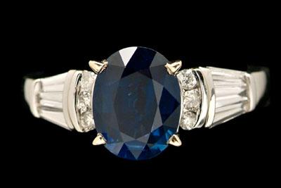 Appraisal: Sapphire diamond ring central oval blue sapphire estimated weight cts