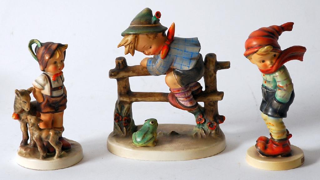 Appraisal: THREE HUMMEL POTTERY FIGURES comprising 'Retreat to Safety' high 'March