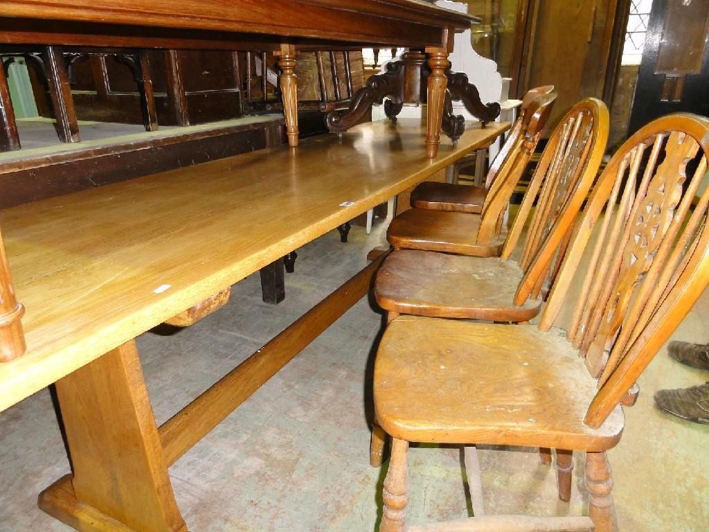 Appraisal: A light oak refectory table the elongated rectangular top raised