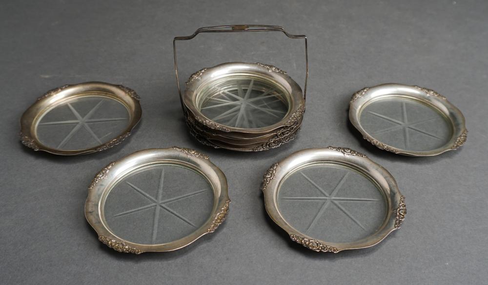 Appraisal: Eight Sterling Silver Mounted Glass Coasters with Housing