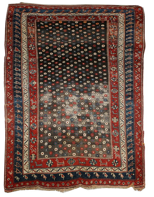 Appraisal: A NORTH WEST PERSIAN RUG with a central pattern of