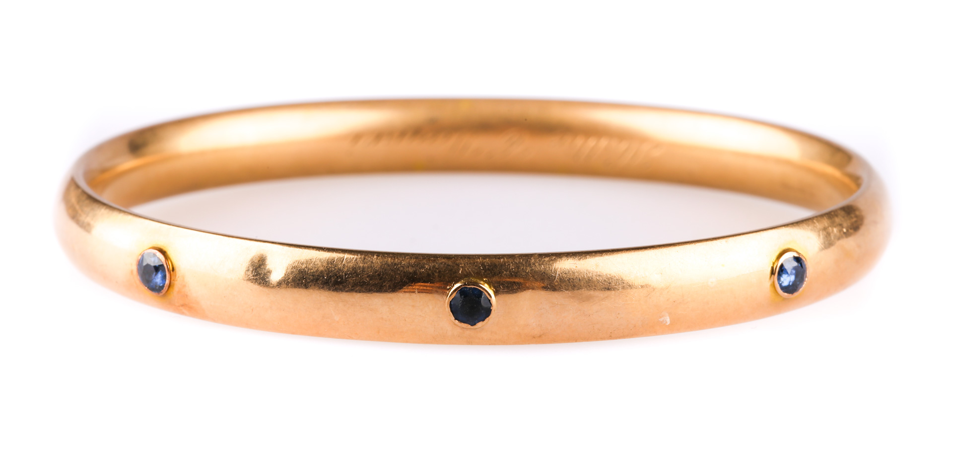 Appraisal: A Sapphire Bangle in K Gold K smooth bangle bracelet