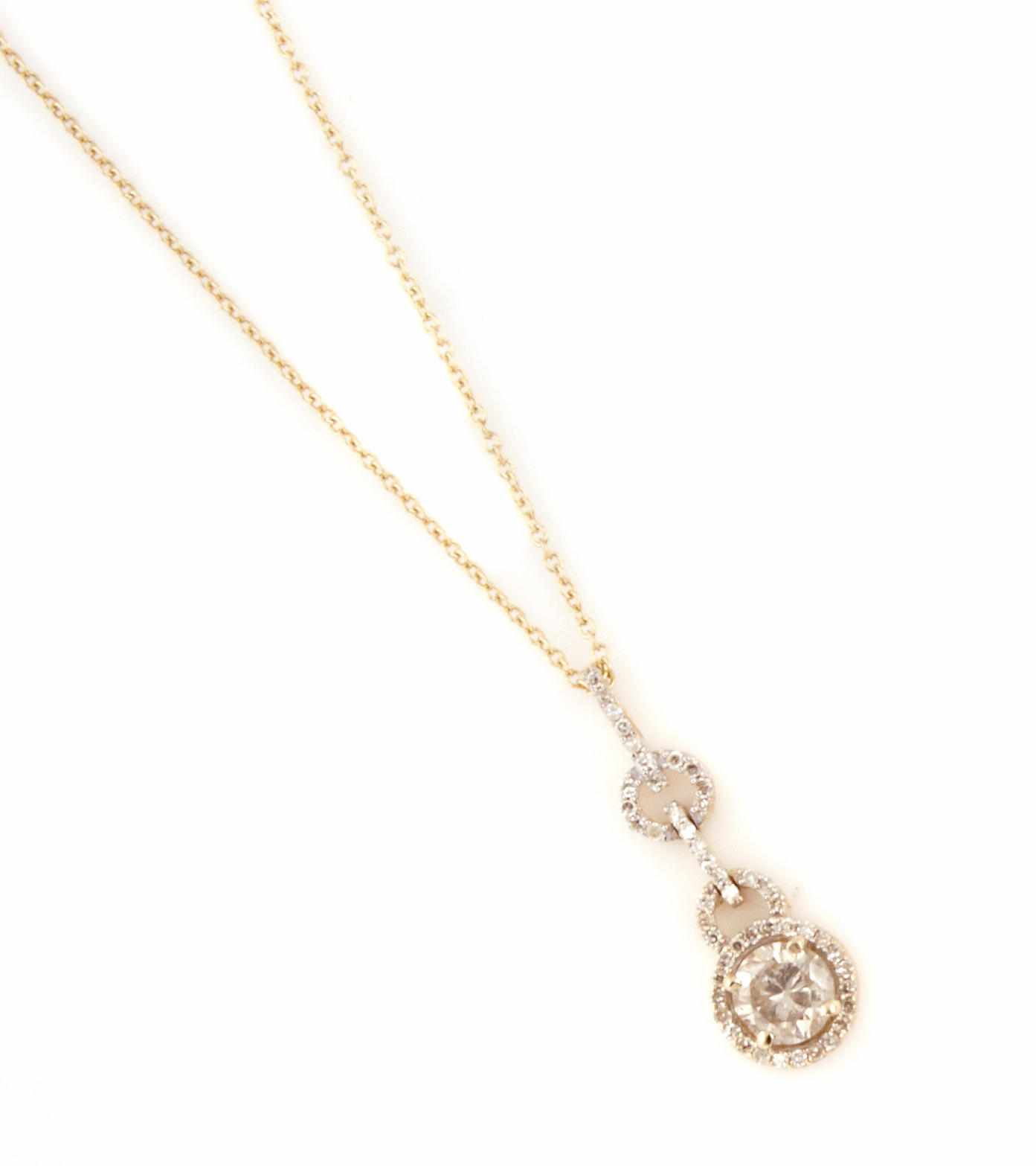 Appraisal: A diamond and k gold pendant with chain length chain