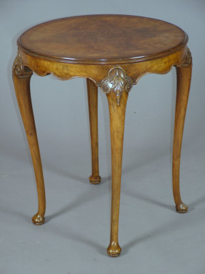 Appraisal: A burr walnut circular occasional table mid th century with