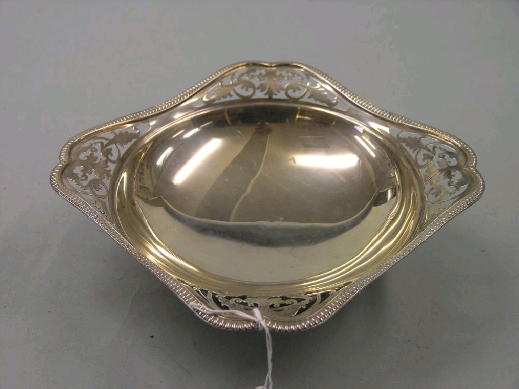 Appraisal: A silver cake stand square shape with pierced corners pedestal