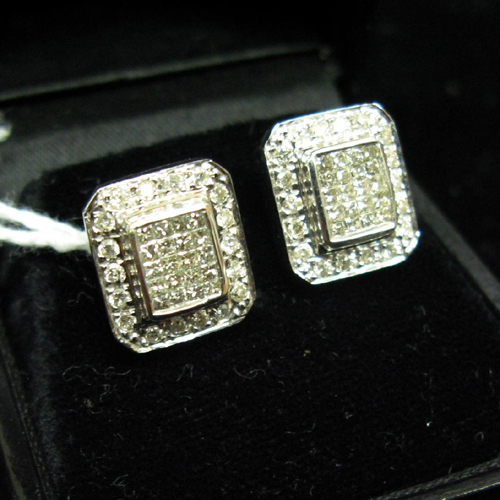 Appraisal: PAIR OF DIAMOND AND FOURTEEN KARAT GOLD EARRINGS Each rectangular