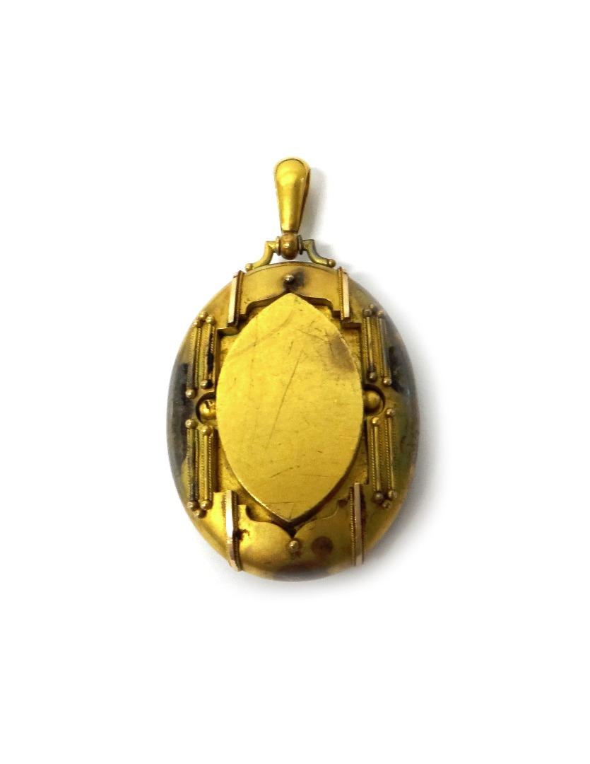 Appraisal: A Victorian gold oval pendant locket glazed with locket compartments