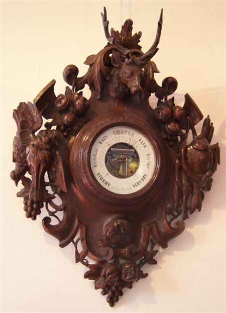 Appraisal: A large late Victorian oak aneroid barometer the ornate architectural