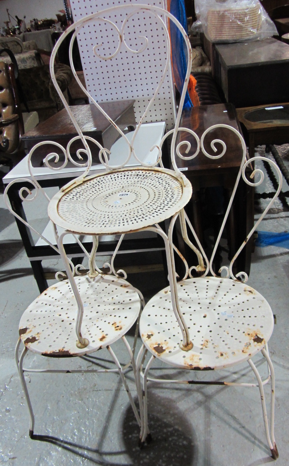 Appraisal: Three white metal garden chairs