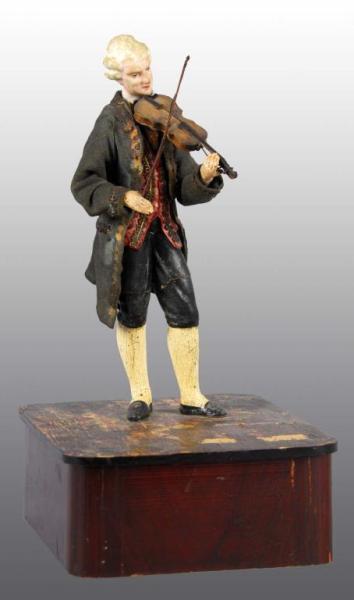 Appraisal: Composition Violin Player Toy on Base Description Figure is composition