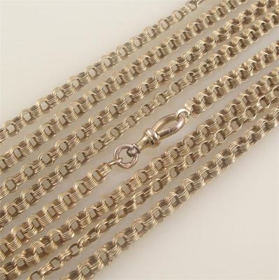 Appraisal: A long gold guard chain each circular link of four