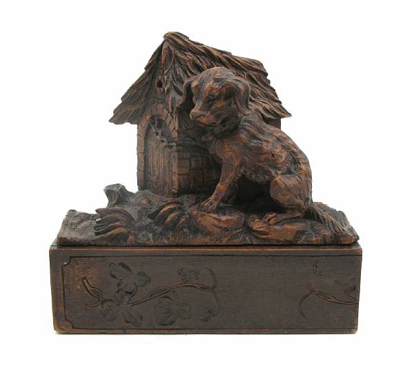 Appraisal: A Black Forest carved lindenwood table box height in width