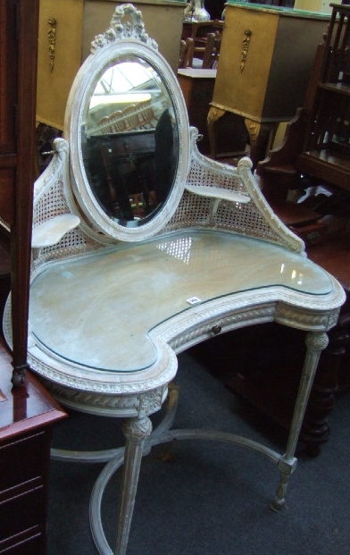 Appraisal: A Louis XVI style dressing table with oval plate and