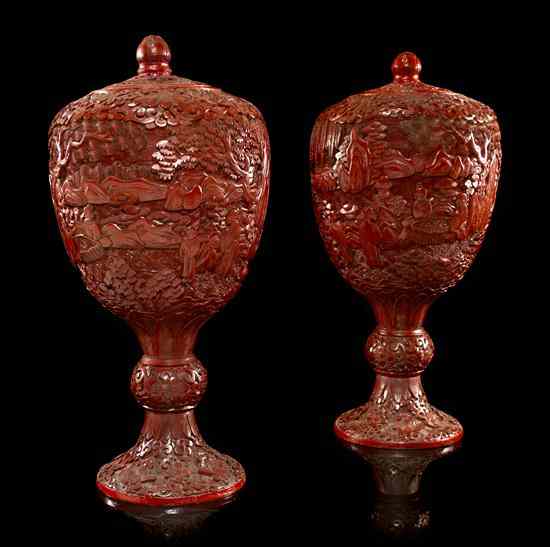 Appraisal: A Pair of Lidded Cinnabar Covered Urns of baluster form