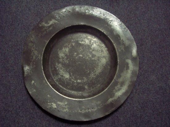 Appraisal: A plain pewter dish the border initialled HIE cm diameter