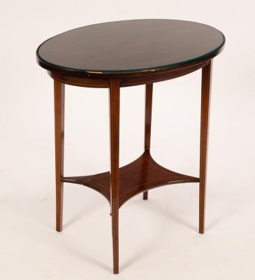 Appraisal: An Edwardian mahogany oval occasional table boxwood and ebony strung