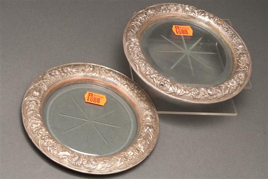 Appraisal: Pair of American repousse silver and glass bottle coasters S