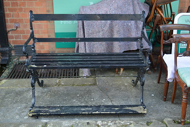 Appraisal: A Victorian black painted cast iron garden bench