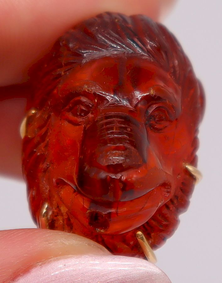 Appraisal: JEWELRY Carved Amber Lion Pendant Beautifully detailed carved amber lion's