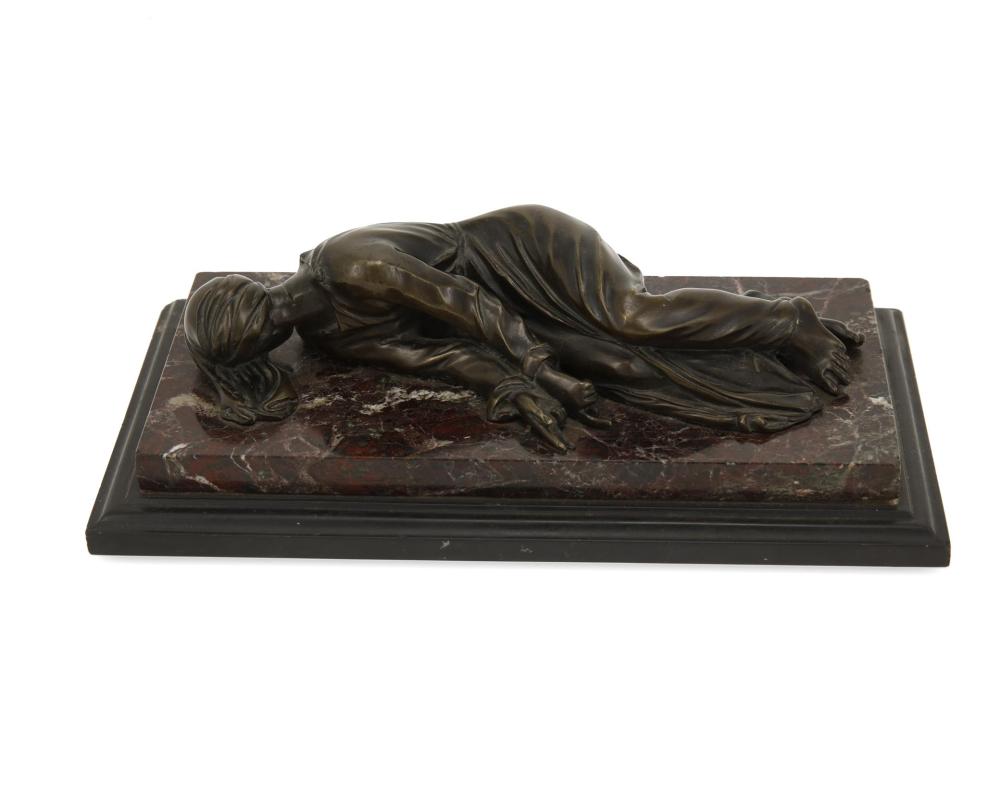 Appraisal: A Continental bronze sculpture of a recumbent figure Late th