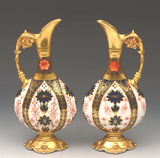 Appraisal: A PAIR OF ROYAL CROWN DERBY EWERS pattern in the