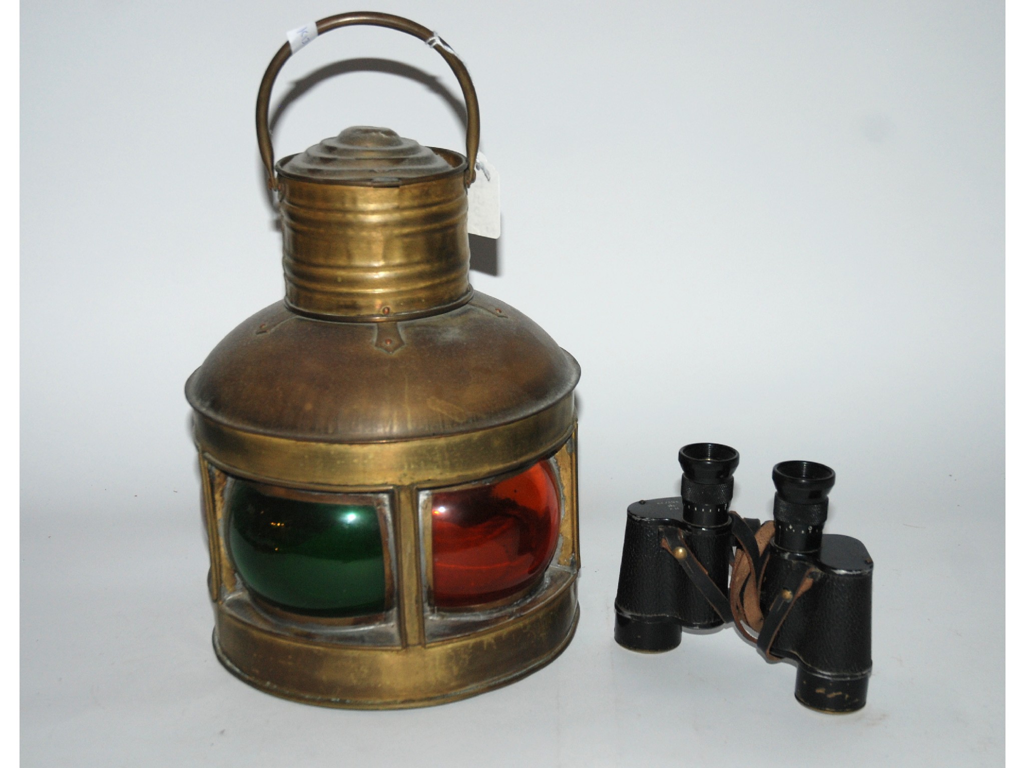 Appraisal: A pair of military binoculars and a brass Masthead ships