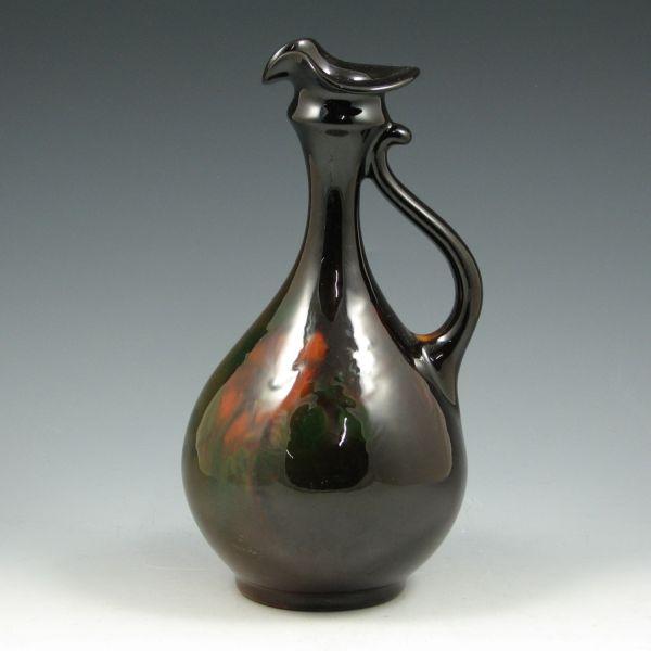 Appraisal: Weller Louwelsa standard glaze trefoil ewer with floral decoration Marked