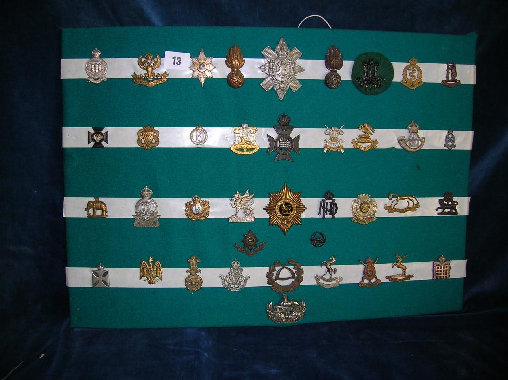 Appraisal: A collection of assorted British military cap badges on card