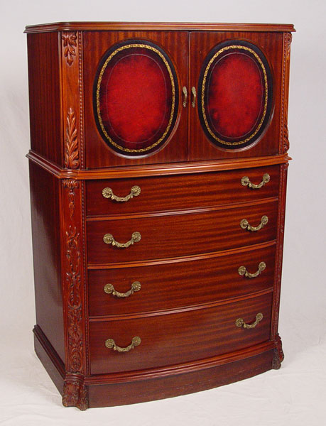 Appraisal: MAHOGANY AND RED LEATHER TALL CHEST CA 'S doors open