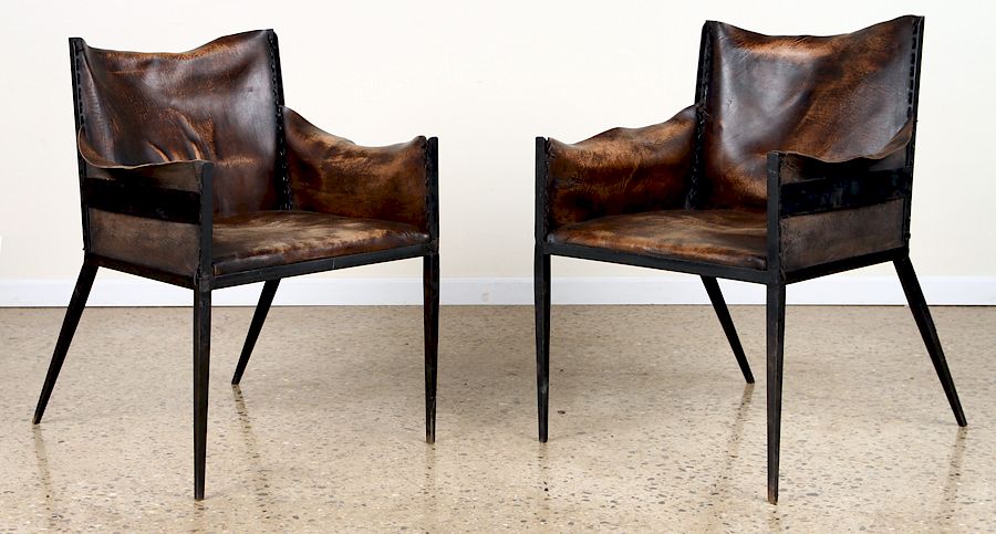 Appraisal: PAIR IRON LEATHER CHAIRS MANNER JEAN-MICHEL FRANK A pair of