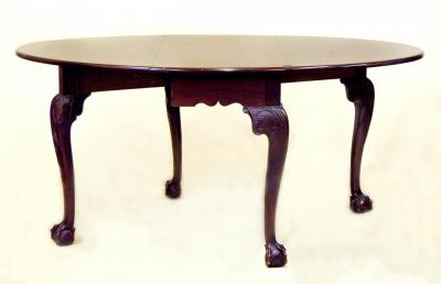 Appraisal: A GEORGE III MAHOGANY DROP LEAF TABLE the moulded edged