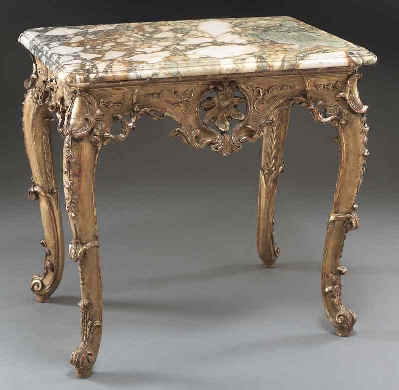 Appraisal: Italian gilt wood table with marble tophaving a shaped and