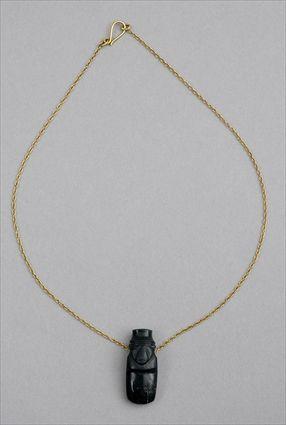 Appraisal: COSTA RICAN PENDANT ON GOLD CHAIN Black jade ax god